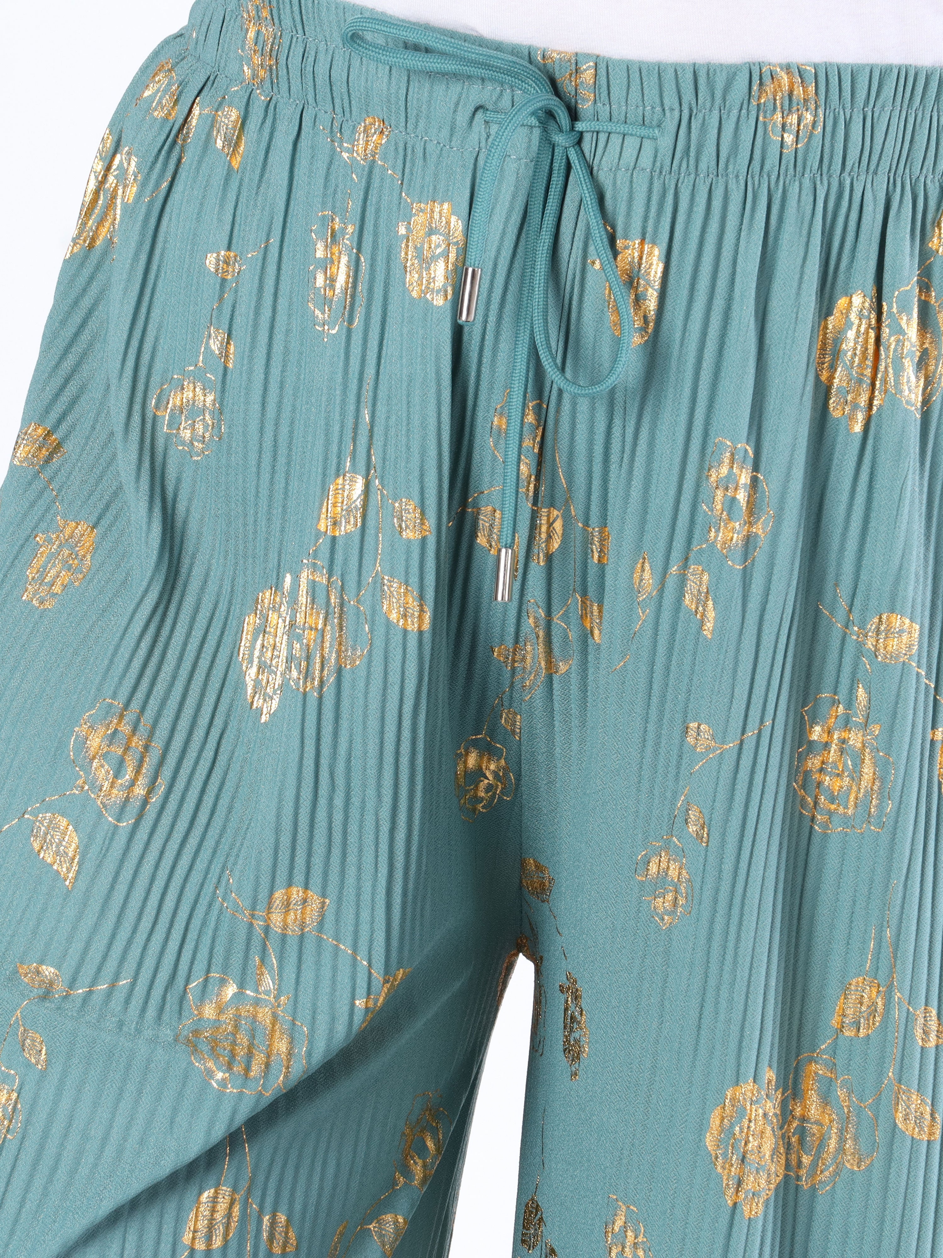 Alpha - Plisserade byxor med guldblommor